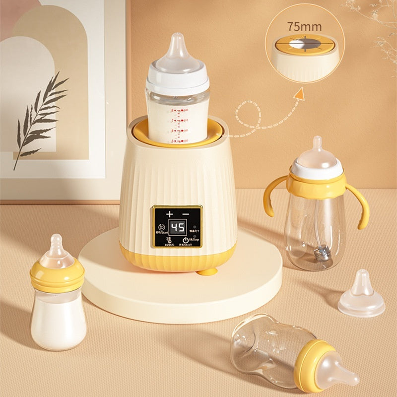 White intelligent constant temperature milk shaker unit holding a baby bottle on a countertop